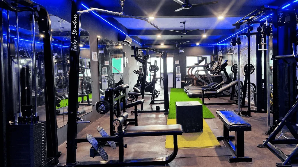 Main gym floor with blue neon accent lighting
